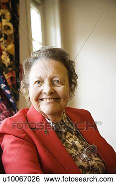 Stock Photo - elderly caucasian 
 woman by window 
at retirement 
community center. 
fotosearch - search 
stock photos, 
pictures, images, 
and photo clipart