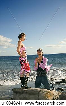 Stock Photography - caucasian young 
adult male kneeling 
to female. fotosearch 
- search stock 
photos, pictures, 
images, and photo 
clipart
