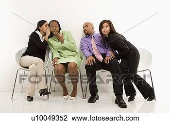 Stock Photo - multi-ethnic businesswomen 
whispering and 
making faces while. 
fotosearch - search 
stock photos, 
pictures, images, 
and photo clipart