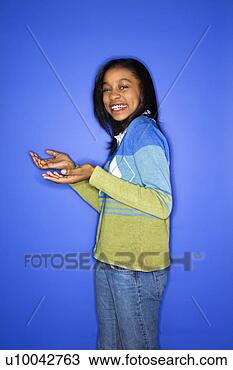 Stock Photo - portrait of african-american 
teen girl with 
palms turned upward. 
fotosearch - search 
stock photos, 
pictures, images, 
and photo clipart
