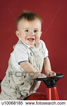 Stock Image - portrait of caucasian 
male child driving 
play car. fotosearch 
- search stock 
photos, pictures, 
images, and photo 
clipart
