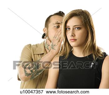Picture - caucasian mid-adult 
man whispering 
into ear of teen 
female. fotosearch 
- search stock 
photos, pictures, 
images, and photo 
clipart