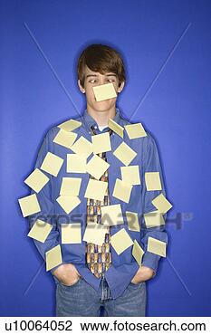Stock Photo - portrait of caucasian 
teen boy standing 
against blue background. 
fotosearch - search 
stock photos, 
pictures, images, 
and photo clipart