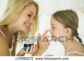 Stock Photo - mother and daughter 
with makeup. fotosearch 
- search stock 
photos, pictures, 
images, and photo 
clipart