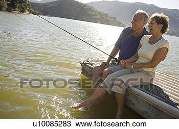 Stock Photo - mature couple 
by lake fishing. 
fotosearch - search 
stock photos, 
pictures, images, 
and photo clipart