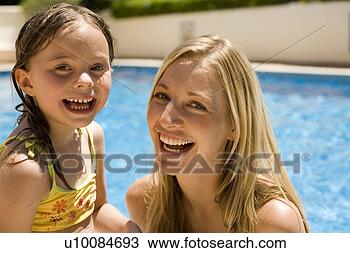 Stock Photo - mother and daughter 
playing in pool. 
fotosearch - search 
stock photos, 
pictures, images, 
and photo clipart