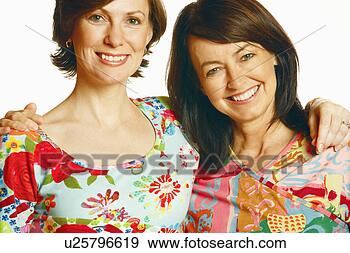 Stock Photograph - portrait of a 
mid adult woman 
and a mature woman 
with their arm. 
fotosearch - search 
stock photos, 
pictures, images, 
and photo clipart