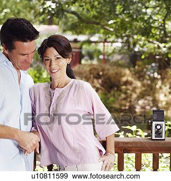 Stock Photograph - mature couple 
leaning against 
a railing. fotosearch 
- search stock 
photos, pictures, 
images, and photo 
clipart