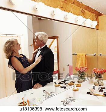 Stock Photo - reflection of 
a mature couple 
looking at each 
other on a mirror. 
fotosearch - search 
stock photos, 
pictures, images, 
and photo clipart