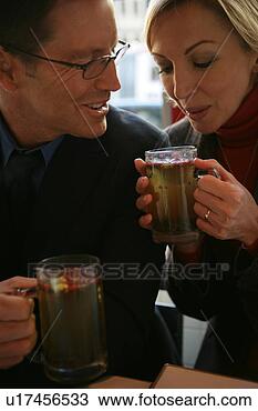 Stock Photo - couple enjoying 
drinks. fotosearch 
- search stock 
photos, pictures, 
images, and photo 
clipart