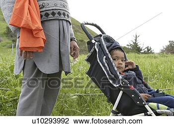 Stock Photo - man with toddler 
in carriage. fotosearch 
- search stock 
photos, pictures, 
images, and photo 
clipart