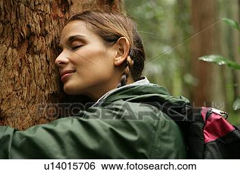 Stock Photo - female hugging 
a tree. fotosearch 
- search stock 
photos, pictures, 
images, and photo 
clipart