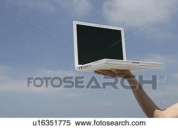 Stock Image - view of a laptop 
held up high. 
fotosearch - search 
stock photos, 
pictures, images, 
and photo clipart