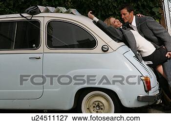 Picture - mature couple 
making out on 
a car. fotosearch 
- search stock 
photos, pictures, 
images, and photo 
clipart