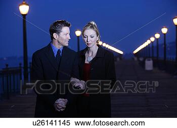 Stock Image - mature couple 
walking together. 
fotosearch - search 
stock photos, 
pictures, images, 
and photo clipart