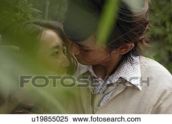 Stock Image - young couple embracing, 
close-up. fotosearch 
- search stock 
photos, pictures, 
images, and photo 
clipart