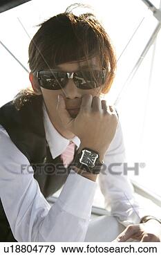 Stock Photograph - view of a young 
man with sunglasses. 
fotosearch - search 
stock photos, 
pictures, images, 
and photo clipart