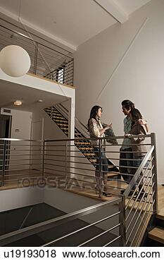 Stock Photo - conversation between 
three friends, 
full length. fotosearch 
- search stock 
photos, pictures, 
images, and photo 
clipart
