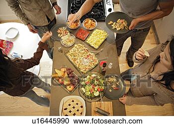 Stock Photography - friends having 
meal, top view. 
fotosearch - search 
stock photos, 
pictures, images, 
and photo clipart