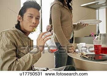 Stock Photography - man having drink, 
looking at camera. 
fotosearch - search 
stock photos, 
pictures, images, 
and photo clipart