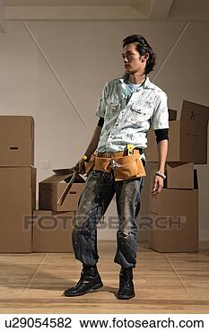 Stock Photo - man holding hammer, 
full length. fotosearch 
- search stock 
photos, pictures, 
images, and photo 
clipart