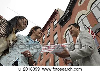 Stock Photograph - three people engaged 
in conversation, 
low angle view. 
fotosearch - search 
stock photos, 
pictures, images, 
and photo clipart