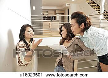 Stock Photography - three young people 
in conversation. 
fotosearch - search 
stock photos, 
pictures, images, 
and photo clipart