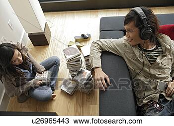 Stock Photo - two people sitting 
inside room, high 
angle view. fotosearch 
- search stock 
photos, pictures, 
images, and photo 
clipart