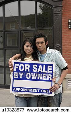 Picture - young couple with 
advertisement 
board, portrait. 
fotosearch - search 
stock photos, 
pictures, images, 
and photo clipart