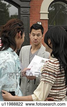 Stock Photo - young couple looking 
at document. fotosearch 
- search stock 
photos, pictures, 
images, and photo 
clipart