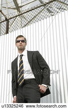 Stock Photo - business man posing 
outside wearing 
shades. fotosearch 
- search stock 
photos, pictures, 
images, and photo 
clipart