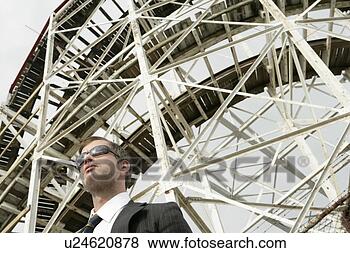 Stock Photo - business man standing 
in front of metal 
structure. fotosearch 
- search stock 
photos, pictures, 
images, and photo 
clipart