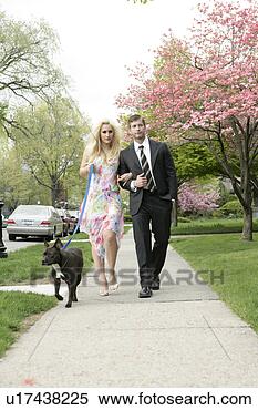 Stock Image - couple walking 
dog. fotosearch 
- search stock 
photos, pictures, 
images, and photo 
clipart