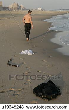 Stock Photo - man leaving his 
clothing behind. 
fotosearch - search 
stock photos, 
pictures, images, 
and photo clipart