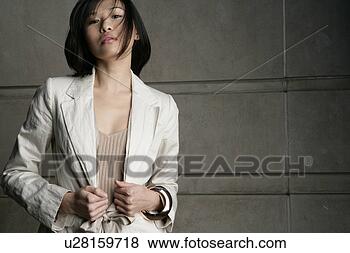 Stock Photo - fashionable asian 
woman posing for 
the camera. fotosearch 
- search stock 
photos, pictures, 
images, and photo 
clipart