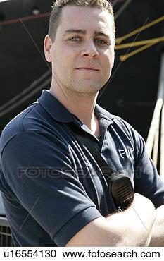 Stock Photography - fireman standing 
with his arms 
folded. fotosearch 
- search stock 
photos, pictures, 
images, and photo 
clipart
