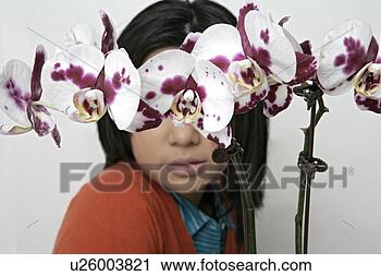 Stock Photography - portrait of a 
teenage girl near 
of flowers. fotosearch 
- search stock 
photos, pictures, 
images, and photo 
clipart