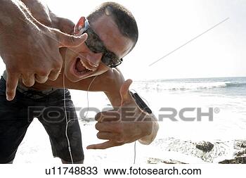 Stock Photo - portrait of a 
young man having 
fun. fotosearch 
- search stock 
photos, pictures, 
images, and photo 
clipart