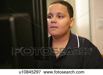 Picture - boy (11-13) operating 
computer. fotosearch 
- search stock 
photos, pictures, 
images, and photo 
clipart