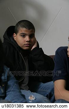 Stock Image - boy (11-13) sitting, 
portrait. fotosearch 
- search stock 
photos, pictures, 
images, and photo 
clipart