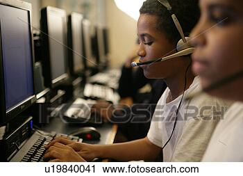 Stock Photography - boys (11-13) operating 
computer. fotosearch 
- search stock 
photos, pictures, 
images, and photo 
clipart
