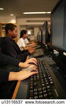 Picture - children (11-13) 
operating computers. 
fotosearch - search 
stock photos, 
pictures, images, 
and photo clipart