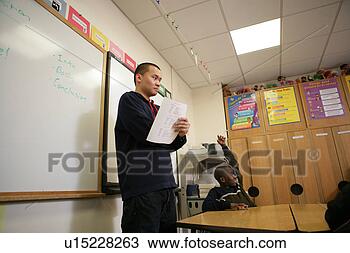 Stock Photo - teenage boy (15-17) 
supervising class, 
low angle view. 
fotosearch - search 
stock photos, 
pictures, images, 
and photo clipart