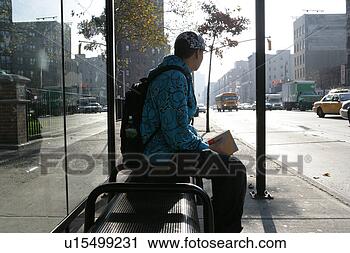 Stock Photography - teenage boy (15-17) 
sitting on bench 
by roadside. fotosearch 
- search stock 
photos, pictures, 
images, and photo 
clipart