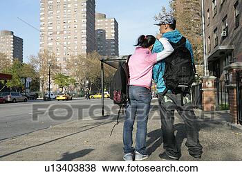 Stock Photo - teenagers (15-17) 
standing on pavement, 
rear view. fotosearch 
- search stock 
photos, pictures, 
images, and photo 
clipart