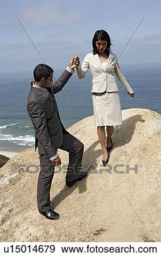 Stock Photograph - view of a man 
holding a woman's 
hand. fotosearch 
- search stock 
photos, pictures, 
images, and photo 
clipart