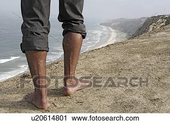 Stock Photography - view of a persons 
barefoot on cliff. 
fotosearch - search 
stock photos, 
pictures, images, 
and photo clipart
