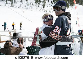 Stock Photograph - couple huggin 
on a ski slope. 
fotosearch - search 
stock photos, 
pictures, images, 
and photo clipart