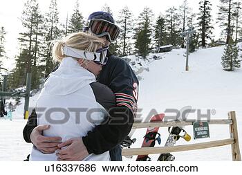 Stock Photo - couple hugging 
on a ski slope. 
fotosearch - search 
stock photos, 
pictures, images, 
and photo clipart