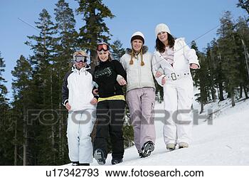 Stock Photo - four women arm 
in arm walking 
down a ski slope. 
fotosearch - search 
stock photos, 
pictures, images, 
and photo clipart